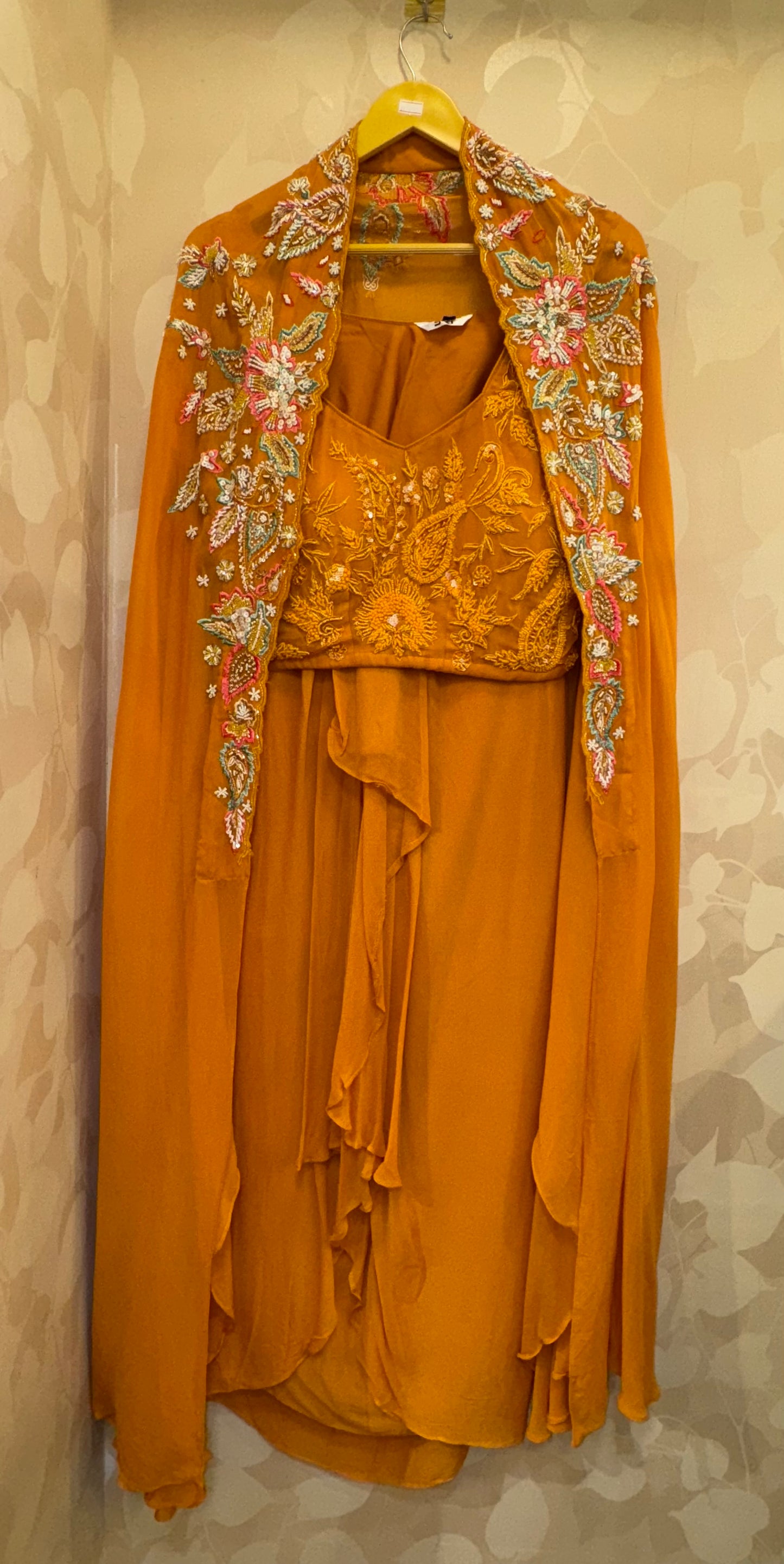 Regal Orange Cape & Cowl Skirt Set with Handcrafted Self-Work Blouse   Dramatic elegance meets artisanal craftsmanship.